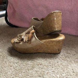 GREETINGS. I am selling a used pair of dress up heels hard wooden details